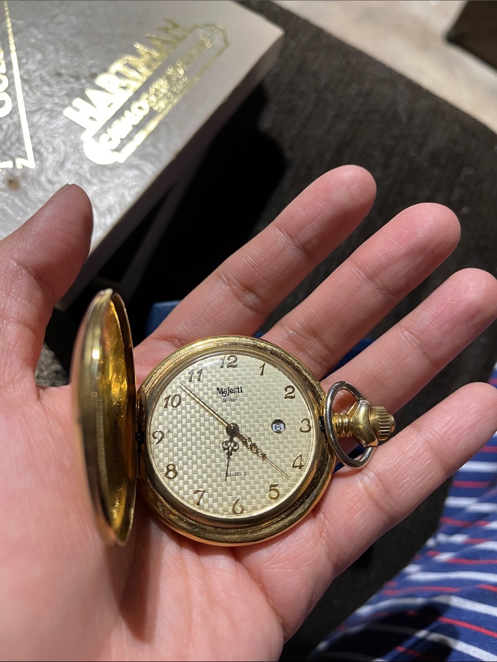 Majesti  Swiss men’s gold-toned pocket watch featuring a hunter-case design.